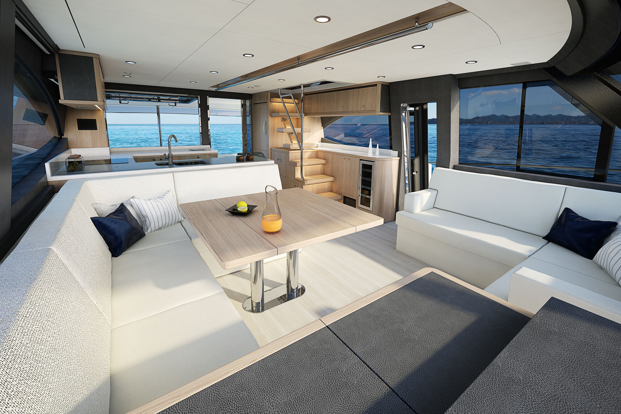 The spacious saloon featrures a plush L-shaped leather lounge dining area with folding timber table.