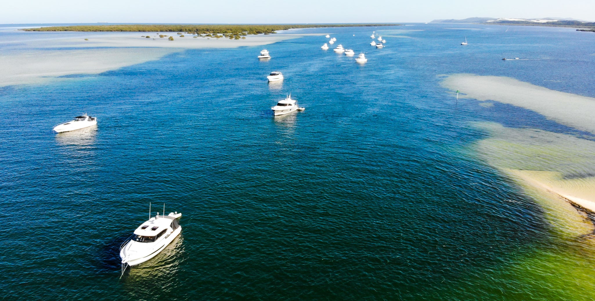 The crystal, calm waters of Days Gutter at Kooringal is a welcome sight to this fleet of Rivieras