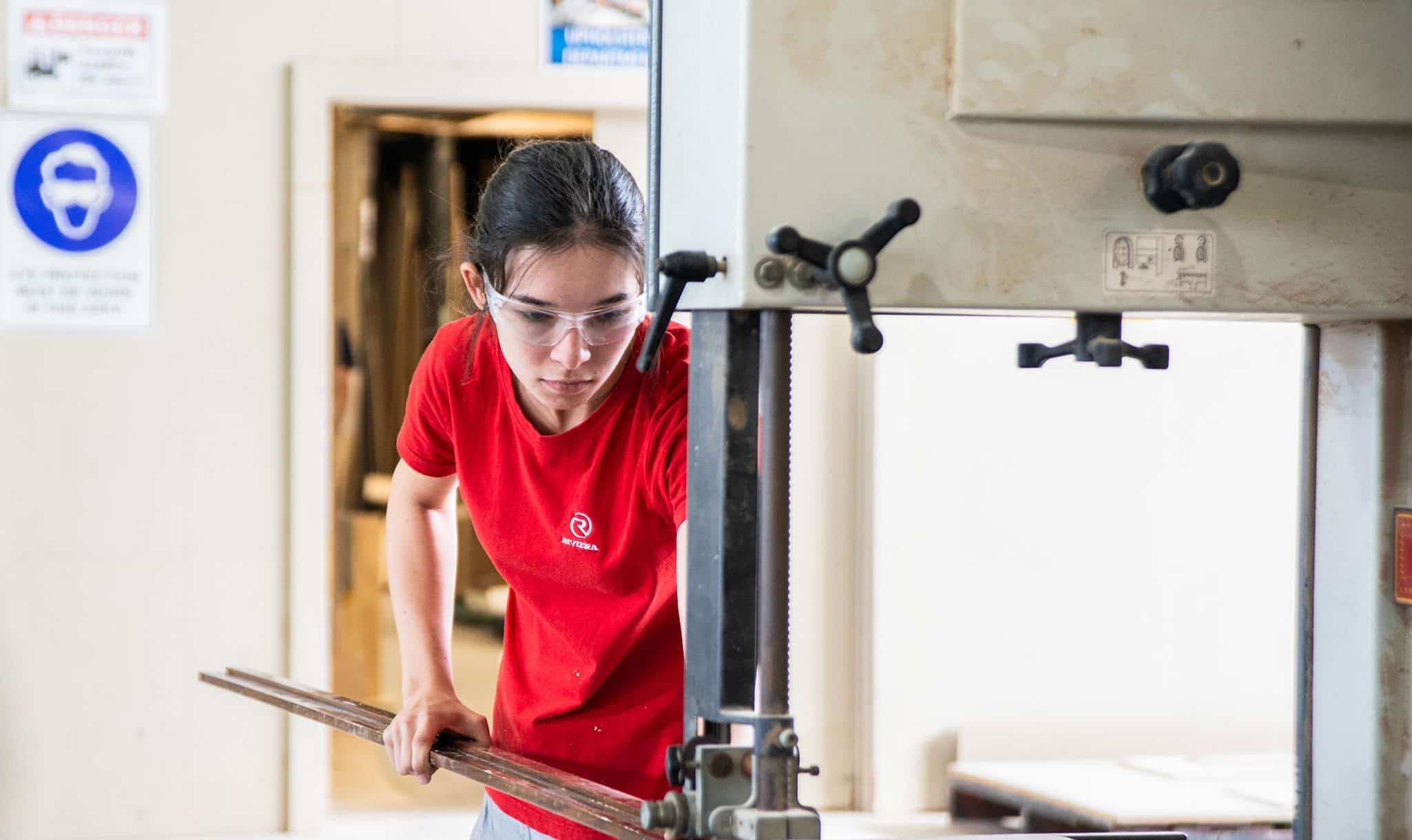 A Riviera apprentice operating the saw
