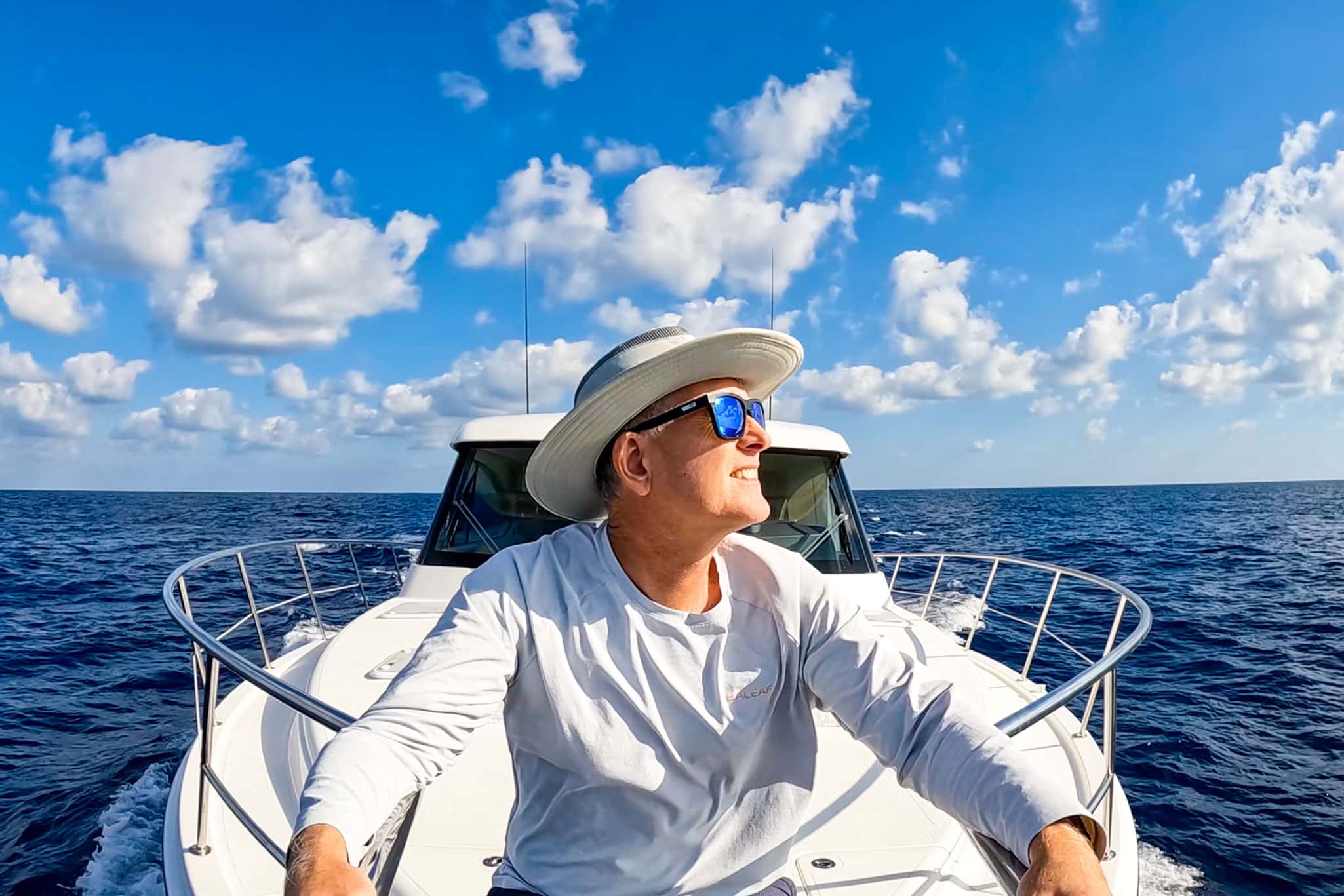 At one with the sea – Lance aboard Caroline 2.0 as they leave Grand Cayman Island in the Caribbean
