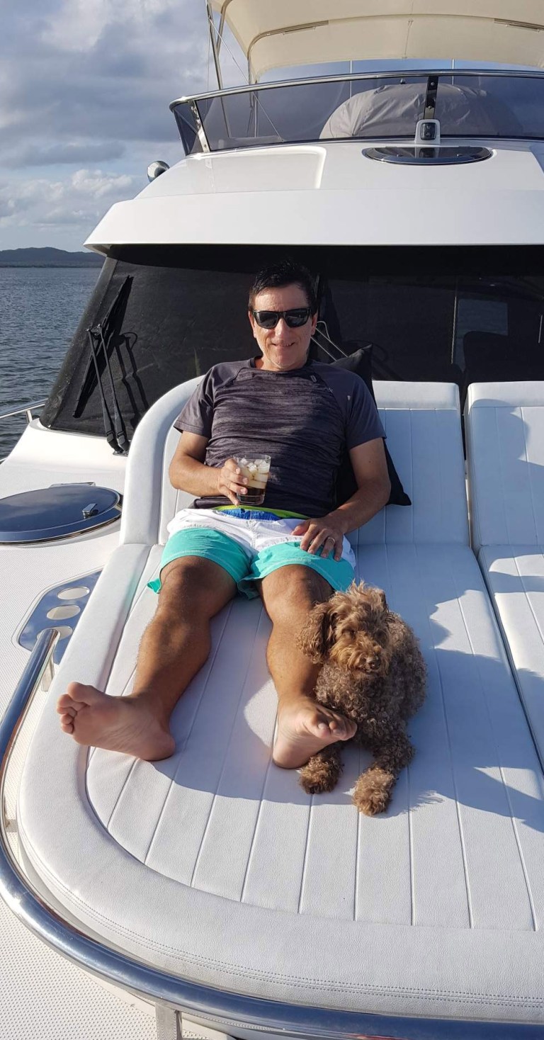 Optm-Tony-Borgia-kicks-back-on-the-foredeck-with-his-frist-mate-Grover