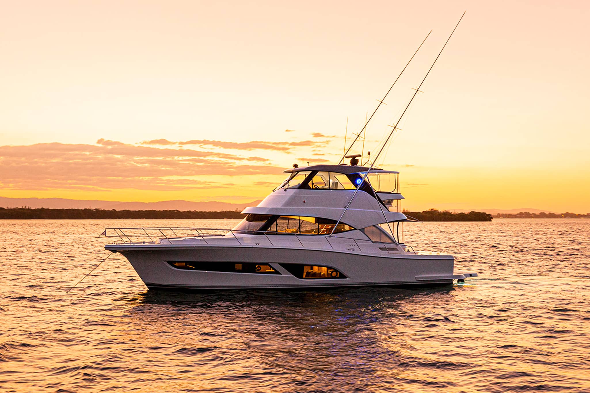 The Riviera 50 Sports Motor Yacht features all-weather, alfresco mezzanine entertaining, spacious luxurious saloon with an internal staircase to the enclosed air-conditioned flybridge, and state-of-the-art helm