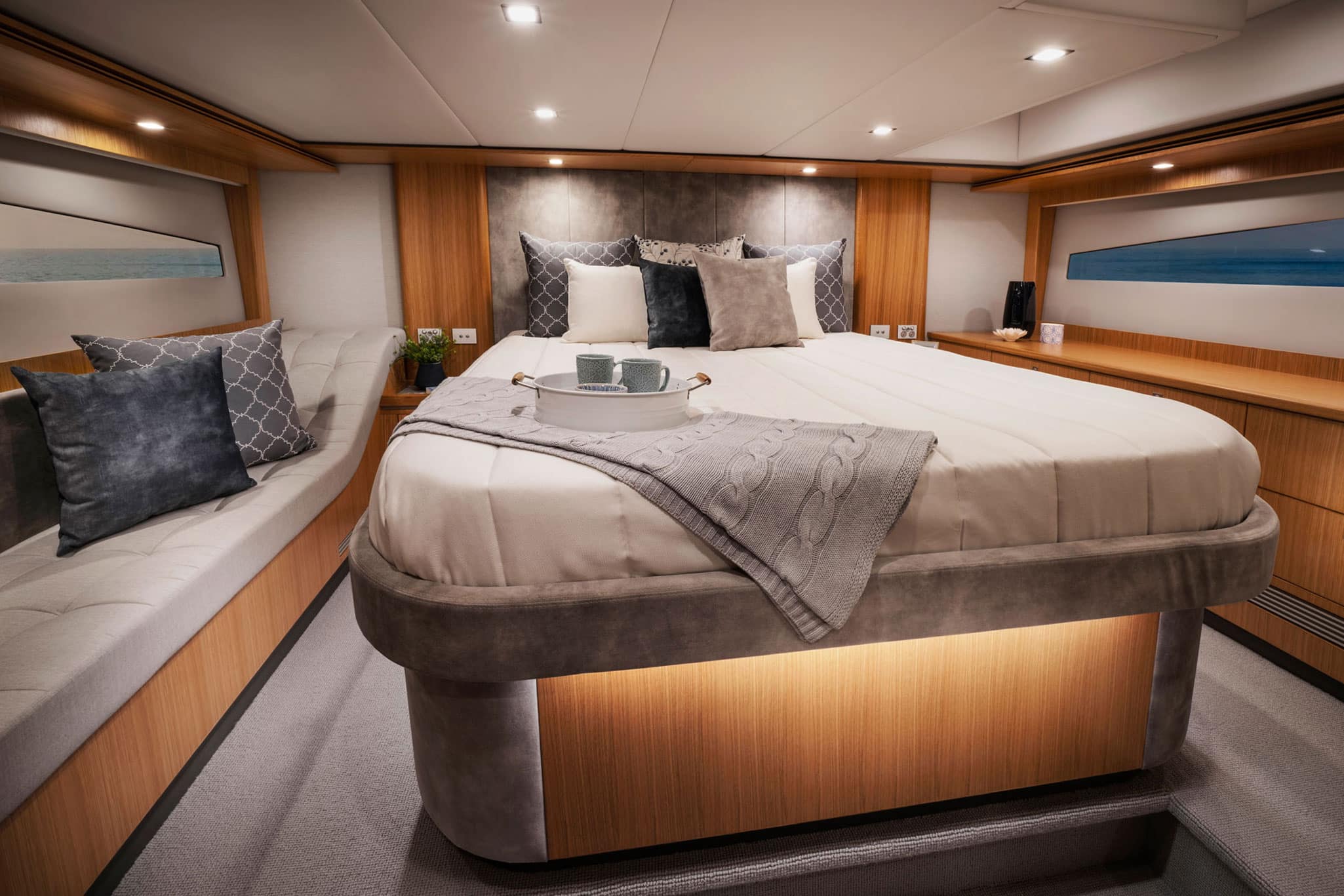 Light fills the VIP guest stateroom of the Riviera 5400 Sport Yacht.