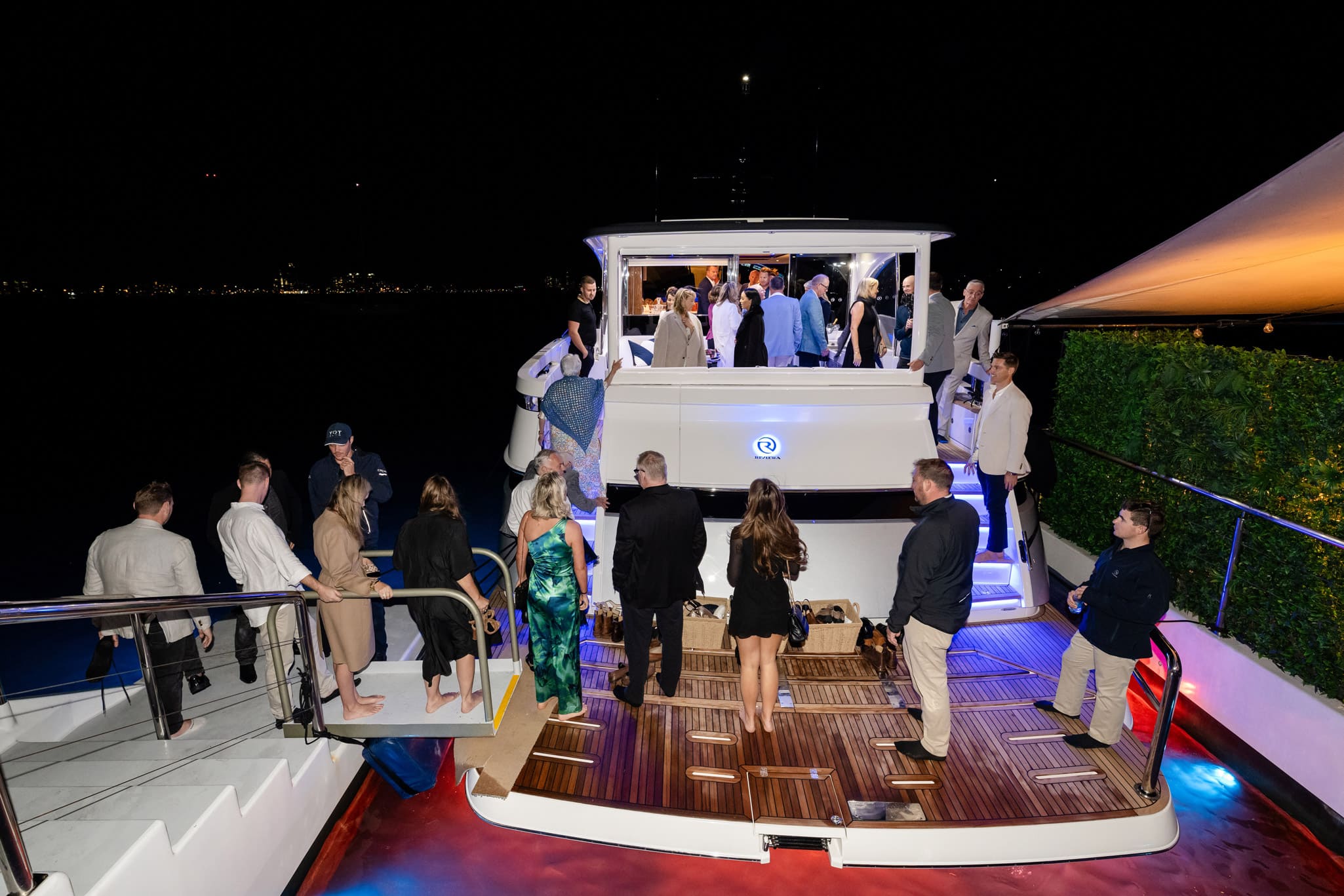 Guests take their first steps on board the luxurious 6800 Sport Yacht Platinum Edition.