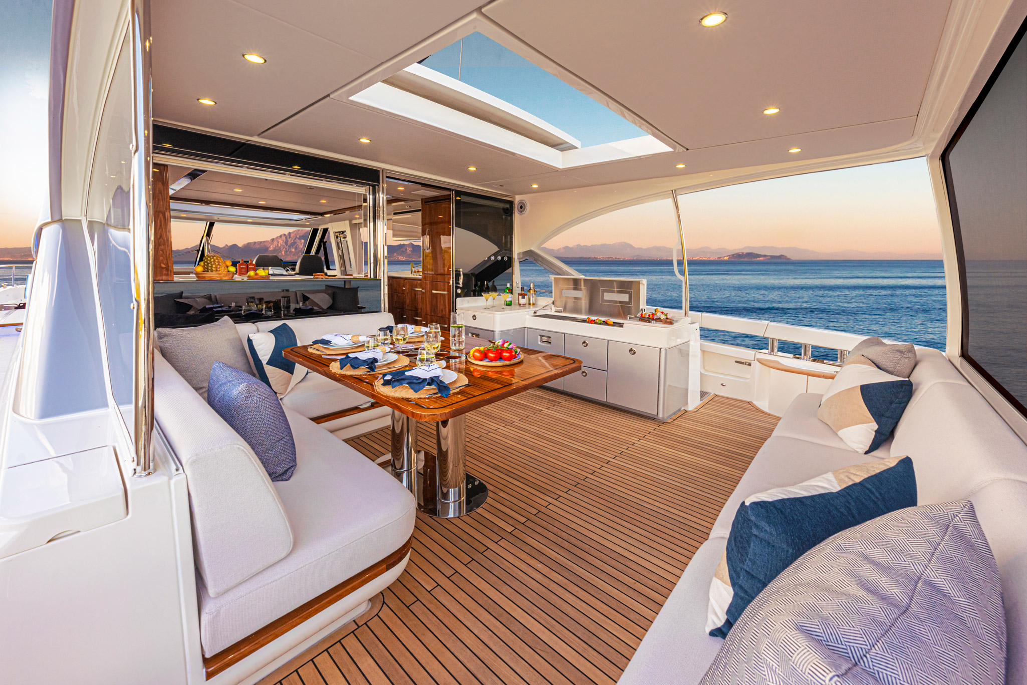 All-seasons aft deck with extended hardtop; the entertaining and dining centre of your luxury motor yacht.