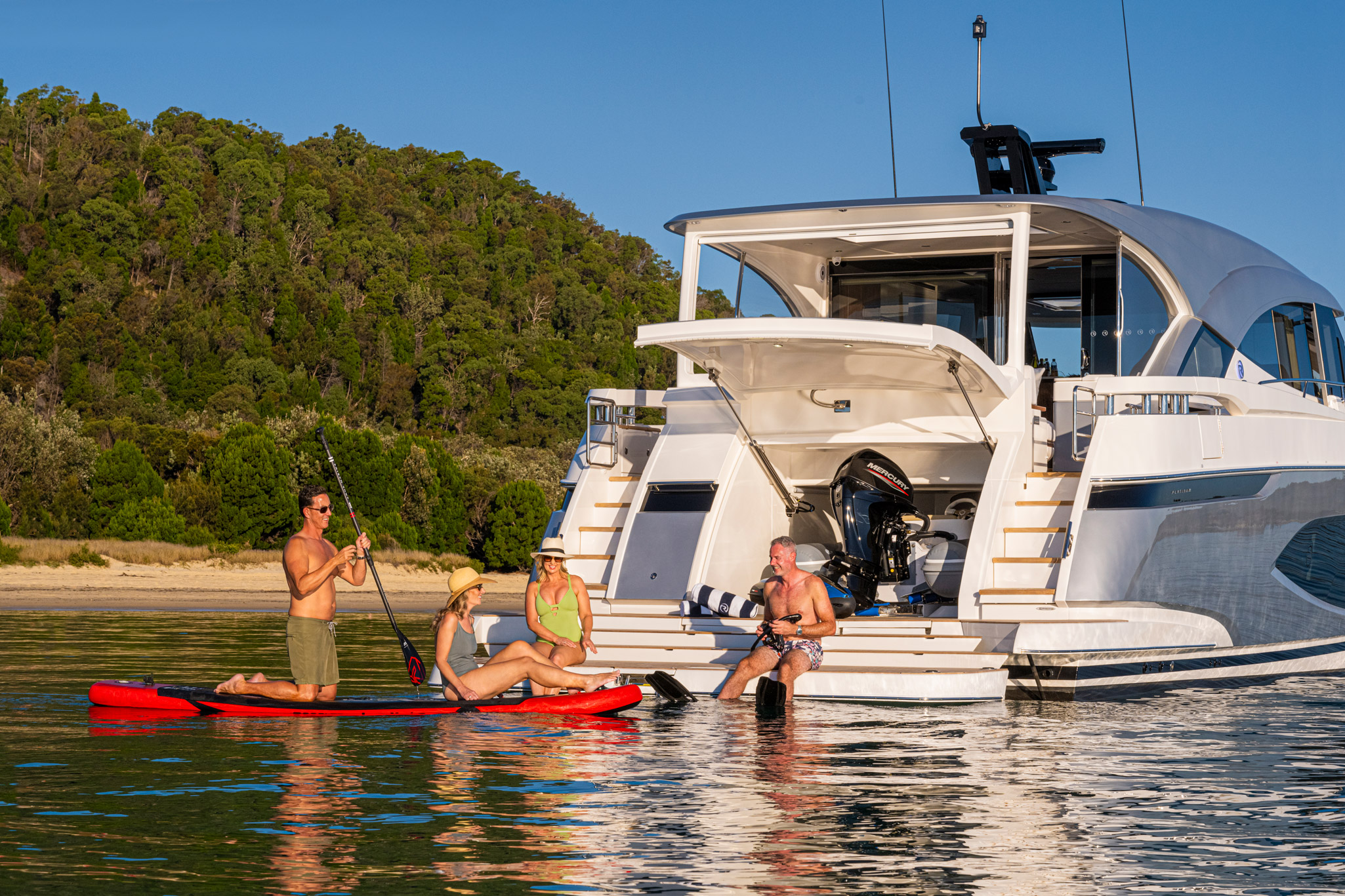 Electro-hydraulic swim platform articulates into steps for easy tender launch and retrieval.