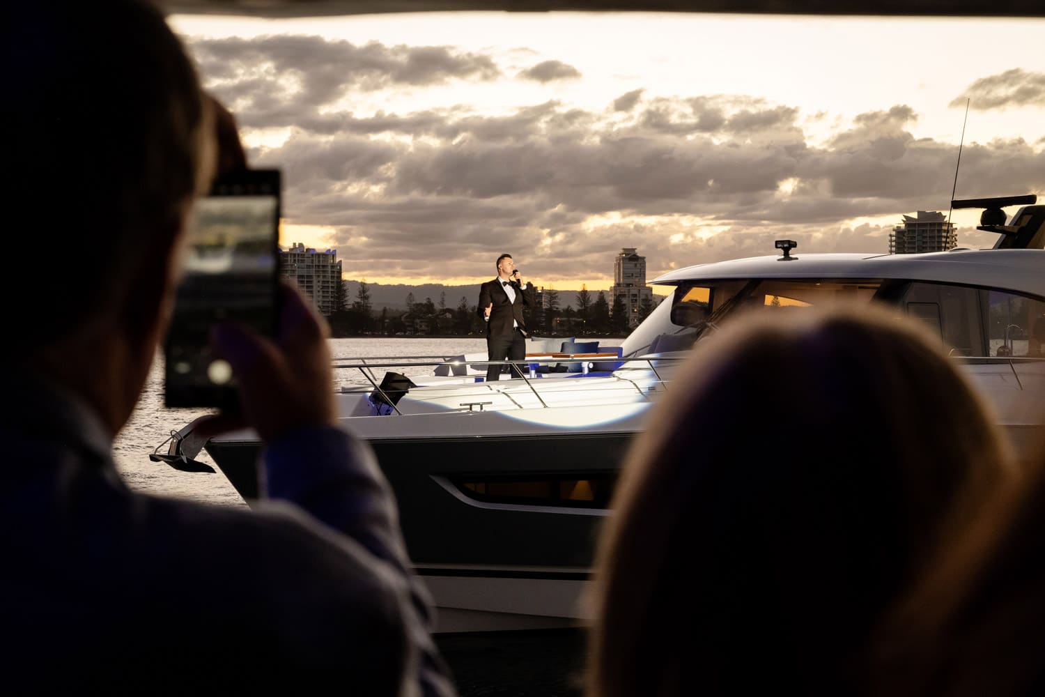 Perfect harmony … an entertainer bursts into song at the 6800 Sport Yacht Platinum Edition launch.