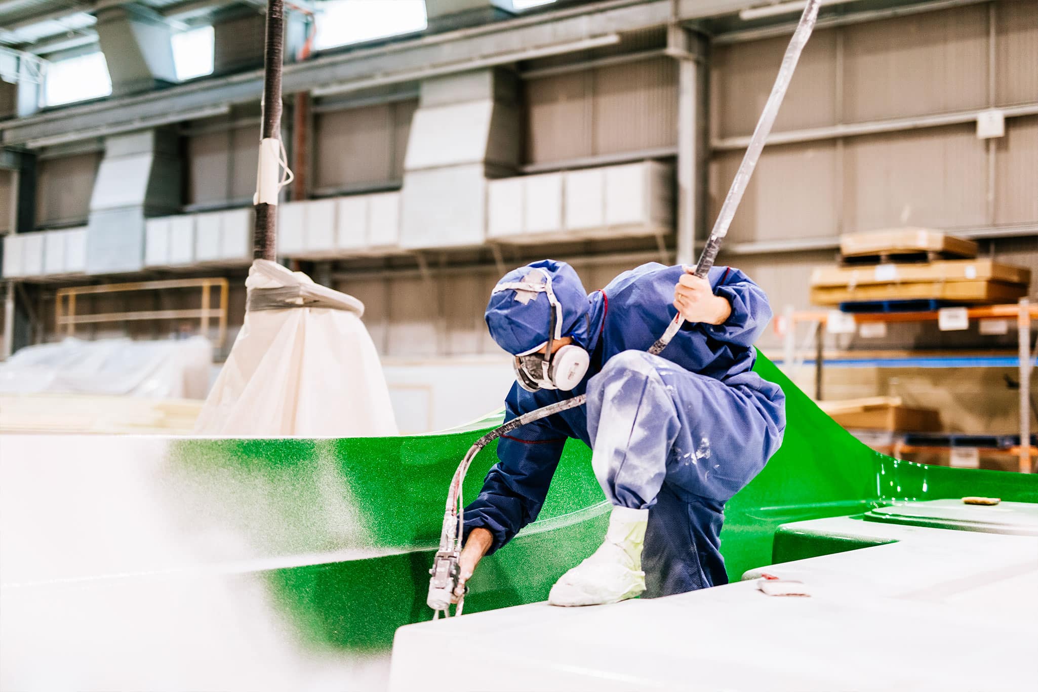 The beginning of a new Riviera yacht, the spraying of isophthalic gelcoat to a highly prepared mould surface
