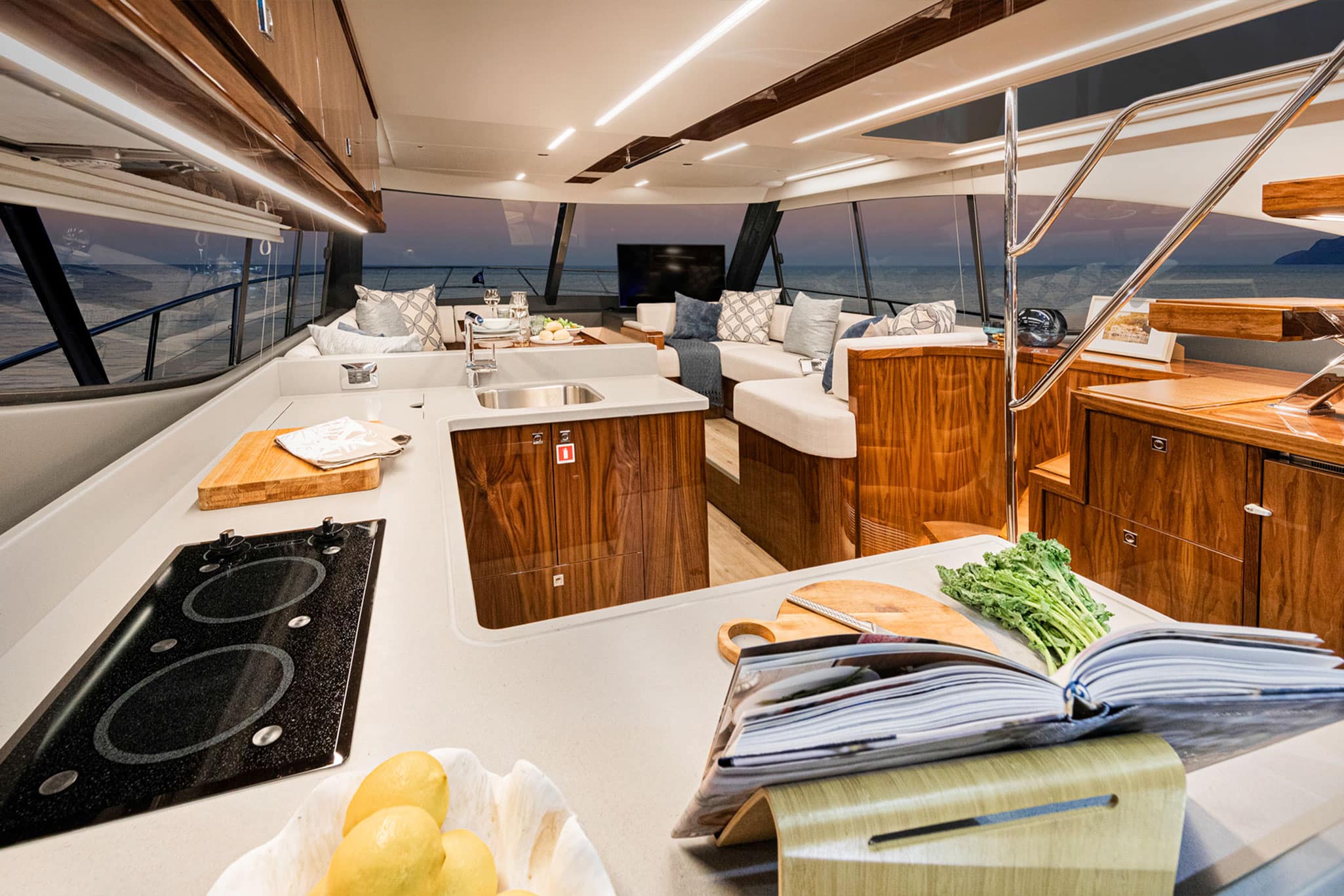 The Riviera 50 Sports Motor Yacht features all-weather, alfresco mezzanine entertaining, spacious luxurious saloon with an internal staircase to the enclosed air-conditioned flybridge, and state-of-the-art helm