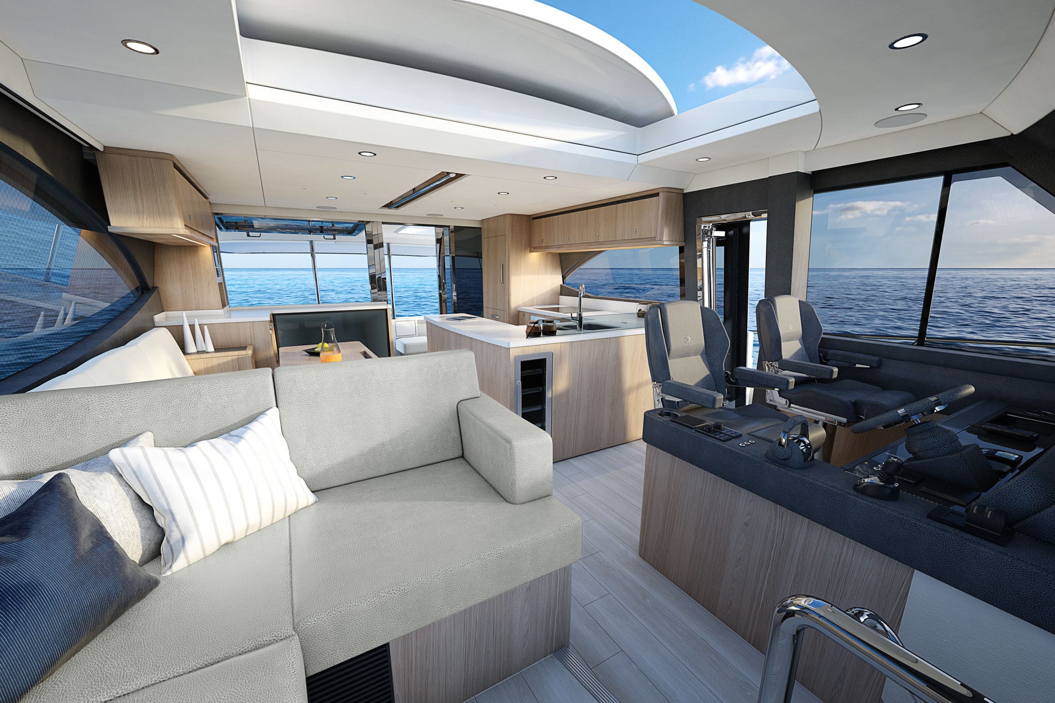The spacious and luminous saloon offers an L-shape lounge opposite the helm, while a large, electric GRP sunroof is built into the hardtop to welcome additional light and fresh air